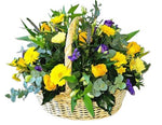 A Basket of Yellow Flowers with a Purple Touch
