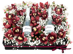 Cymbidium Flowers in a box with Bottles of Prosecco