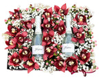 Cymbidium Flowers in a box with Bottles of Prosecco