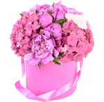 Pink peonies and hydrangea bouquet in a box