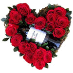 Red roses heart box with wine