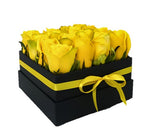 Box of yellow roses